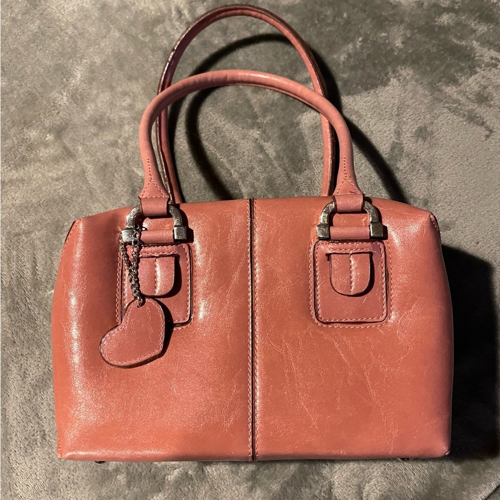 Rina Rich dusty rose leather handbag.